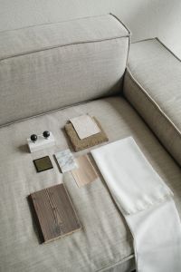 Kaboompics - Neutral Interior Material Board on Textured Sofa