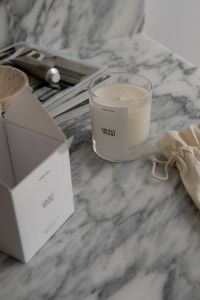 Kaboompics - Aromatic Candle Revealed from Gift Packaging