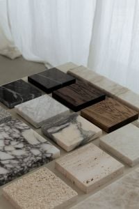 Kaboompics - Architectural Material Swatches on a Studio Table with Sheer Curtains