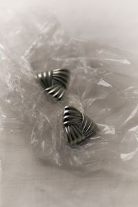 Kaboompics - Silver Triangle Earrings in Clear Plastic
