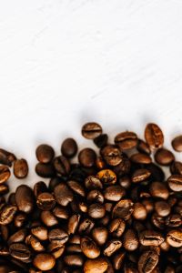 Kaboompics - White Textured Copy Space with Coffee Beans Along the Bottom Edge