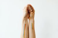 Kaboompics - Close-Up of Rainbow Paint on Two Women's Forearms