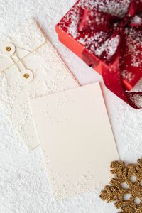 Kaboompics - Red Christmas Gift Box with Blank Card, Gold Tags and Snowflake Decoration