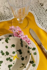 Kaboompics - Crystal Goblet, Vintage Cutlery and Green Dot Plate on Yellow Placemat
