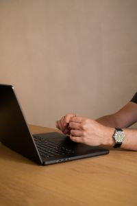 Kaboompics - Man Working on a Laptop at a Minimal Desk