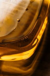 Kaboompics - Amber Liquid in Glass Texture Close Up