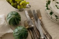 Kaboompics - Easter Table Setting with Cutlery Green Fruit and Plates