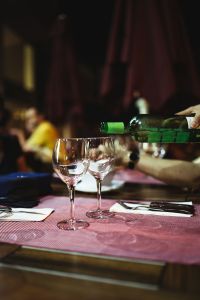 Kaboompics - Pouring white wine into glasses