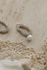 Kaboompics - Beige Satin Bra with Lace and Silver Earrings