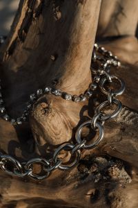 Kaboompics - Silver Chain Jewelry Styled on Weathered Wood, Coastal Still Life