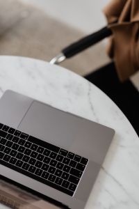Kaboompics - MacBook Pro 15 laptop and iPhone 11 Pro on a marble table