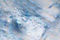 Kaboompics - Blue and White Foaming Cleanser Swirls with Clear Bubble Clusters, Skincare Macro