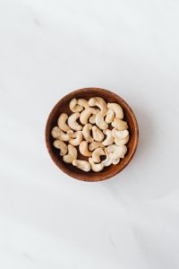 Healthy Snack Photography with Cashews, Walnuts and Passion Fruit on White Marble