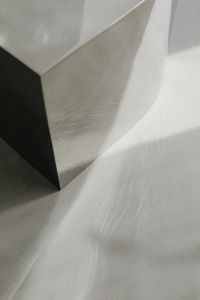 Kaboompics - Chrome Armchair Beside Reflective Chrome Side Table