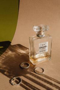 Kaboompics - Chanel No. 5 Perfume Bottle with Rings in Sunlight