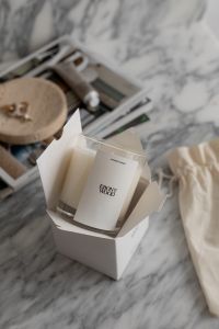 Kaboompics - Hands Unwrapping a Luxury Candle