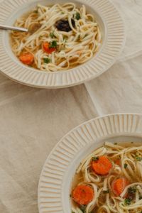 Kaboompics - Chicken Soup Bowl in Soft Focus with Noodles and Carrots