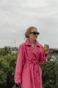 Kaboompics - Woman in a Pink Trench Coat Holding a Coffee Cup