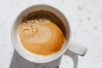 Kaboompics - Overhead Coffee with Crema in White Ceramic Mug