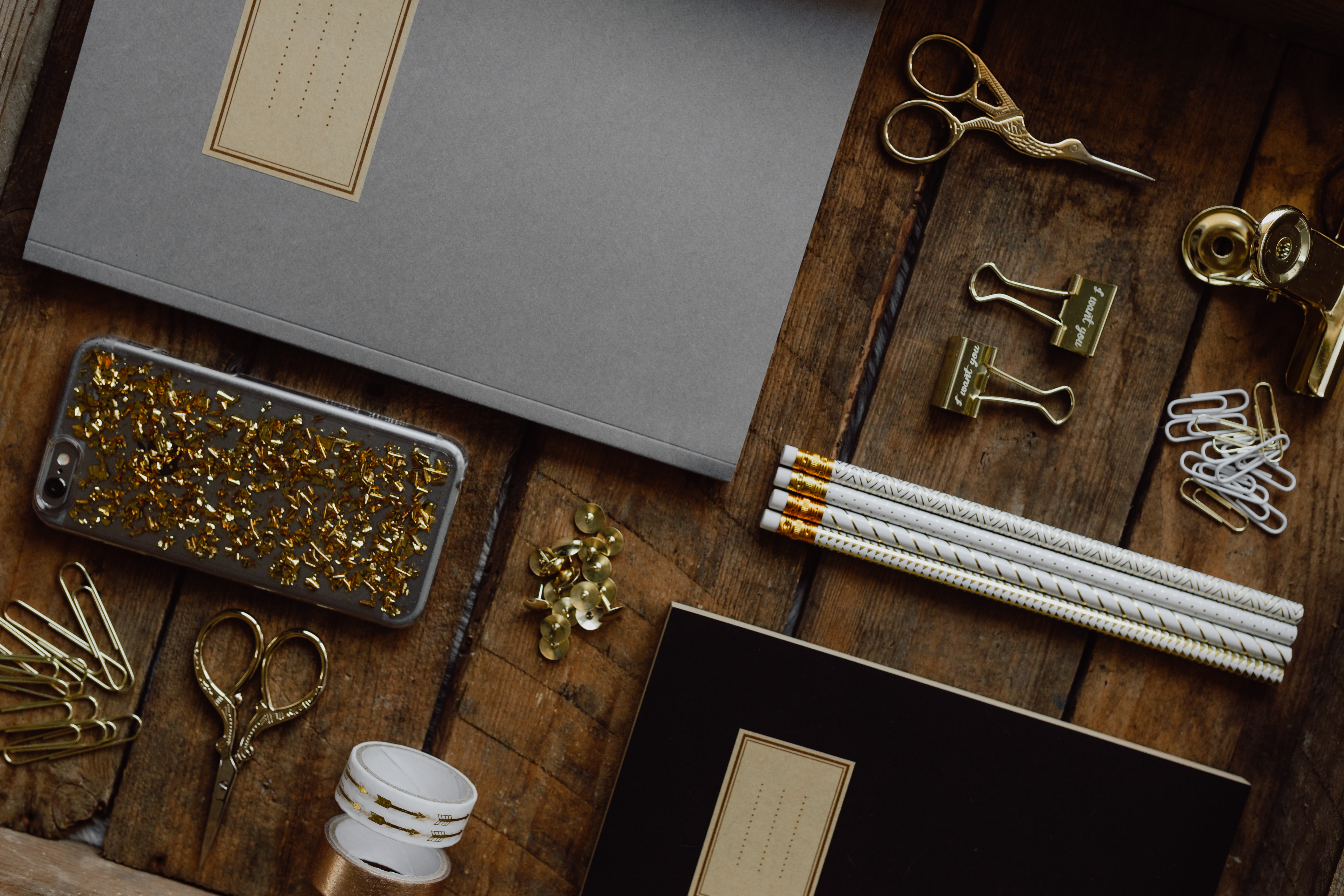 Office accessories on an old wooden tray