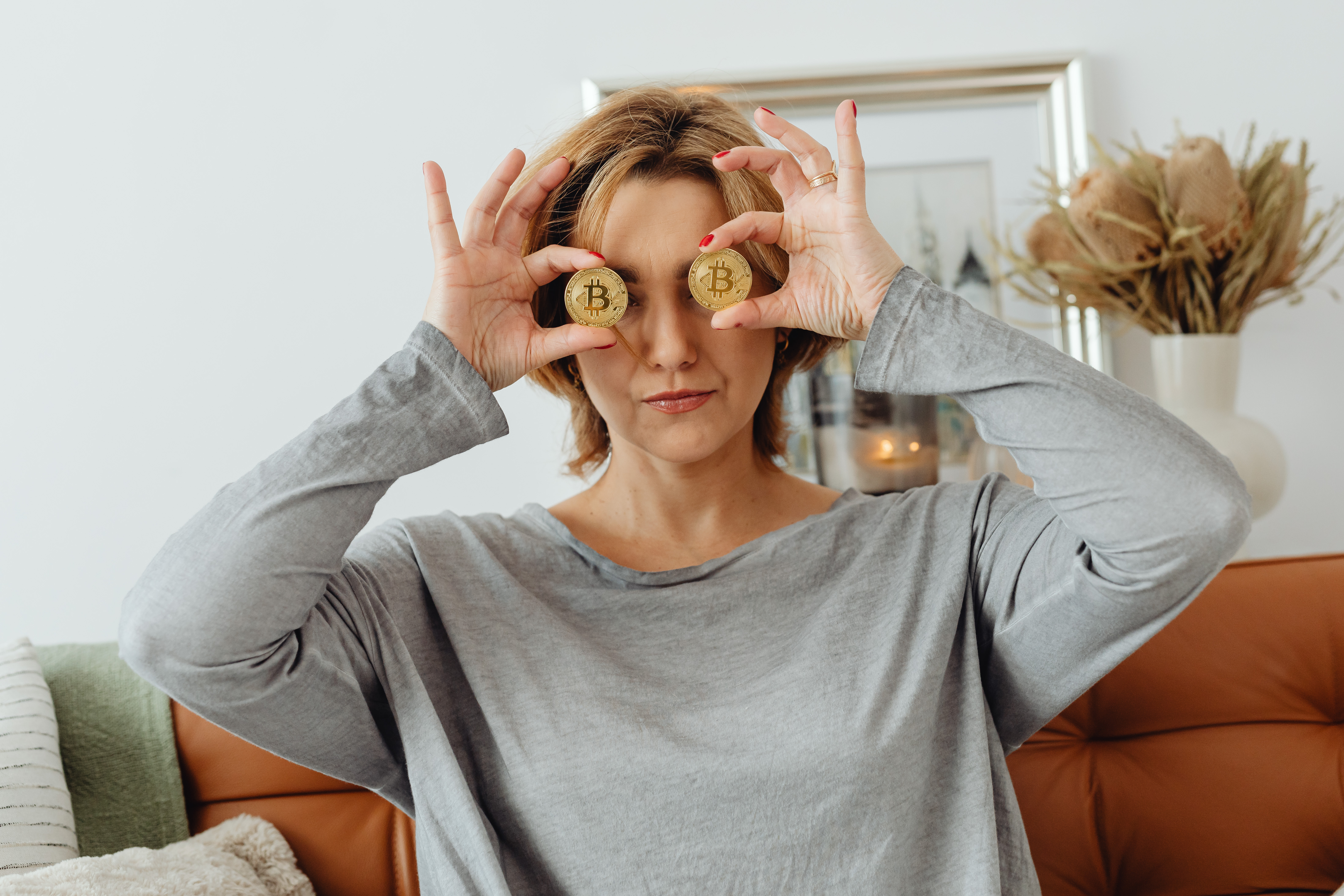 The woman holds a Cryptocurrency Bitcoin