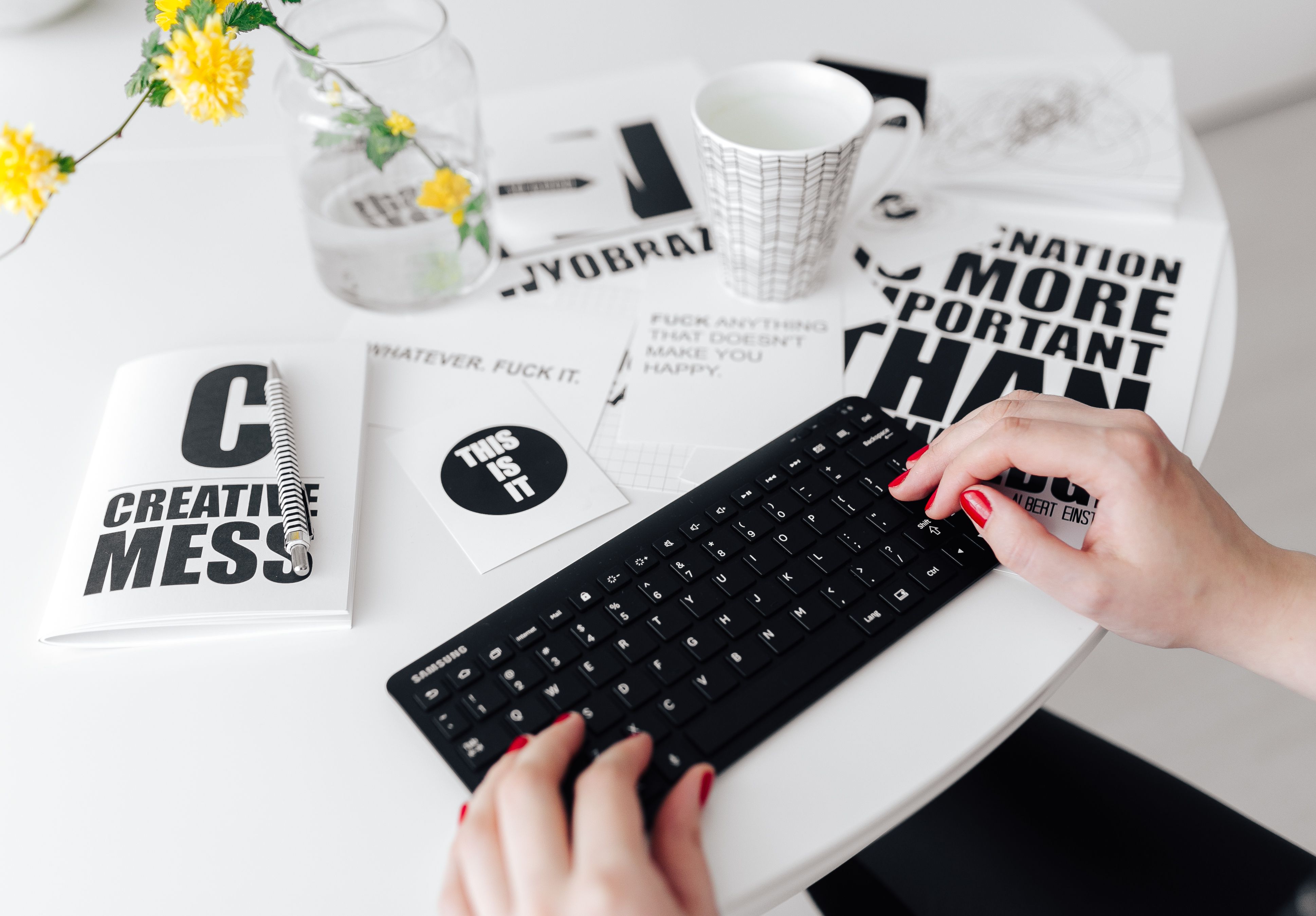 Female hands typing on the remote wireless computer keyboard