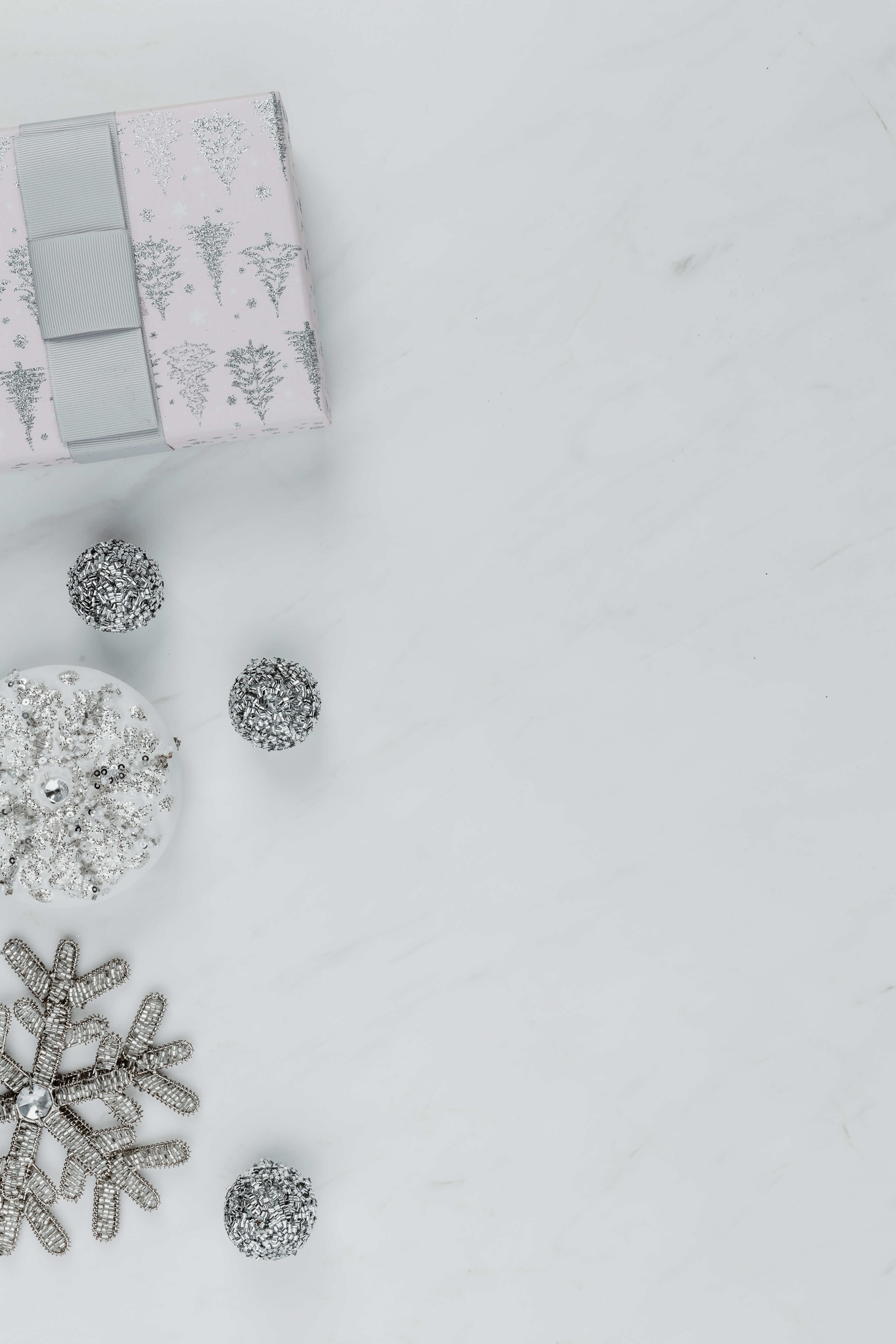 Holiday backgrounds with silver decorations on marble