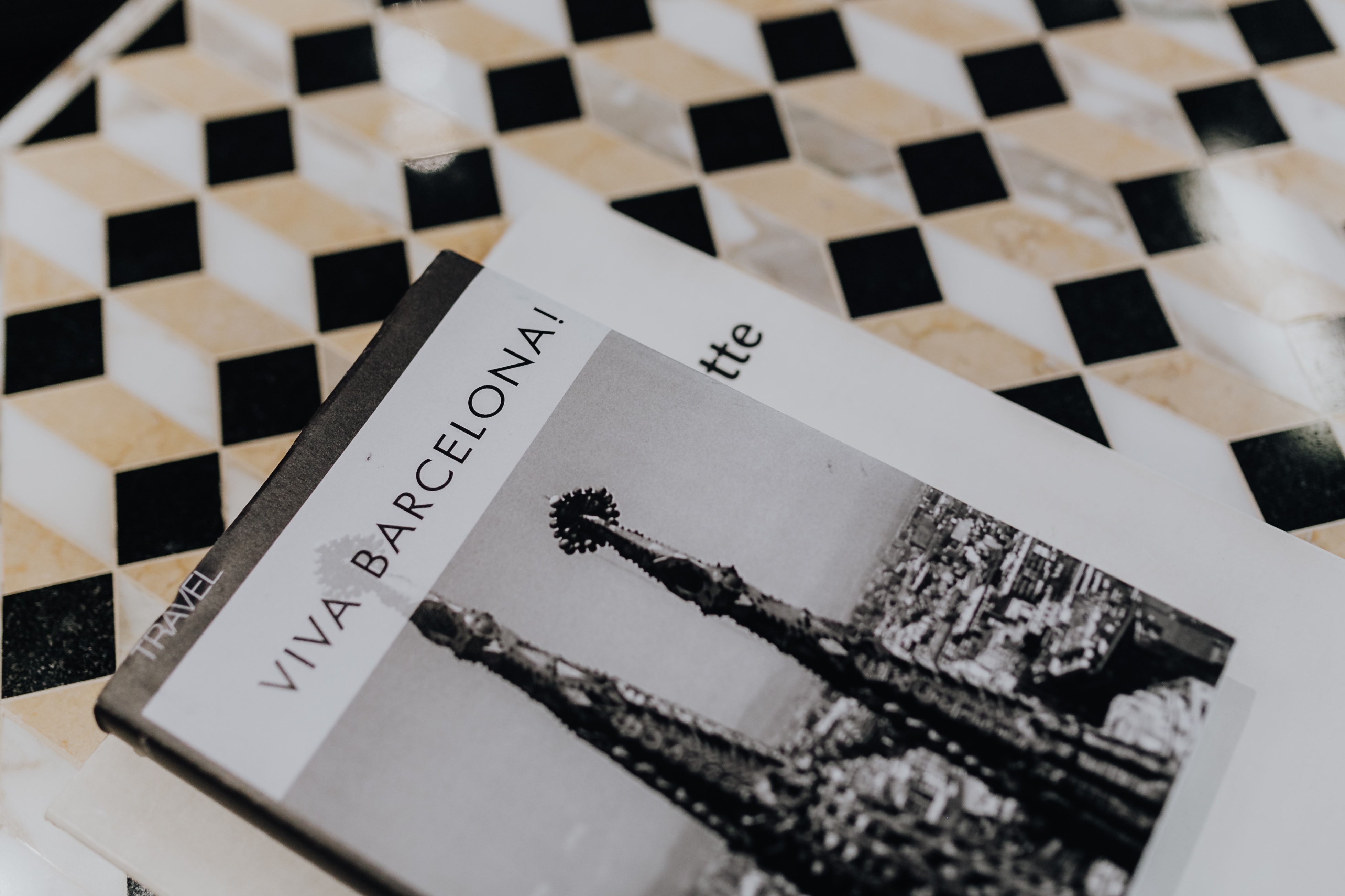 Books on marble table, Barcelona Guide