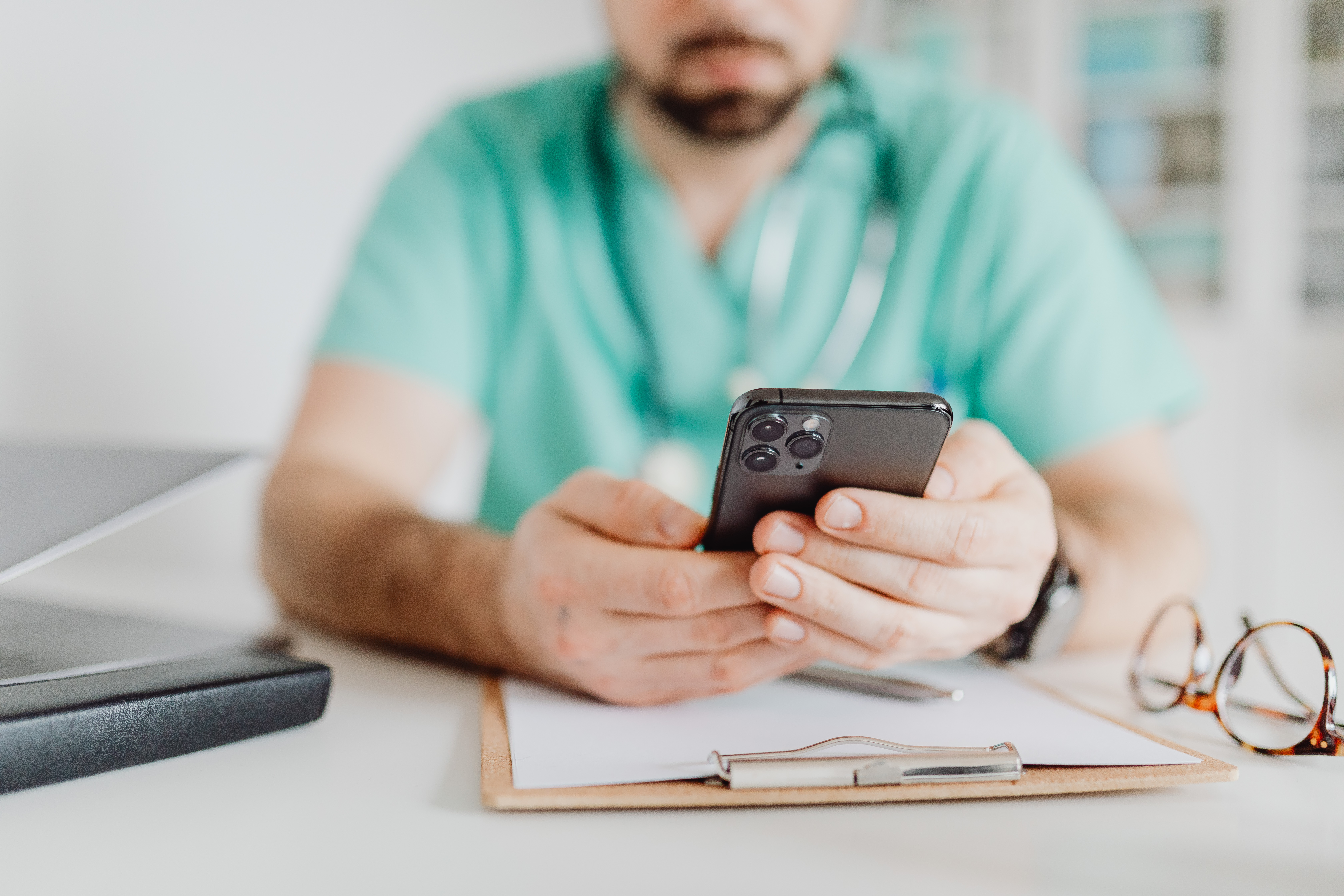 Male Medicine Doctor Holding Mobile Phone