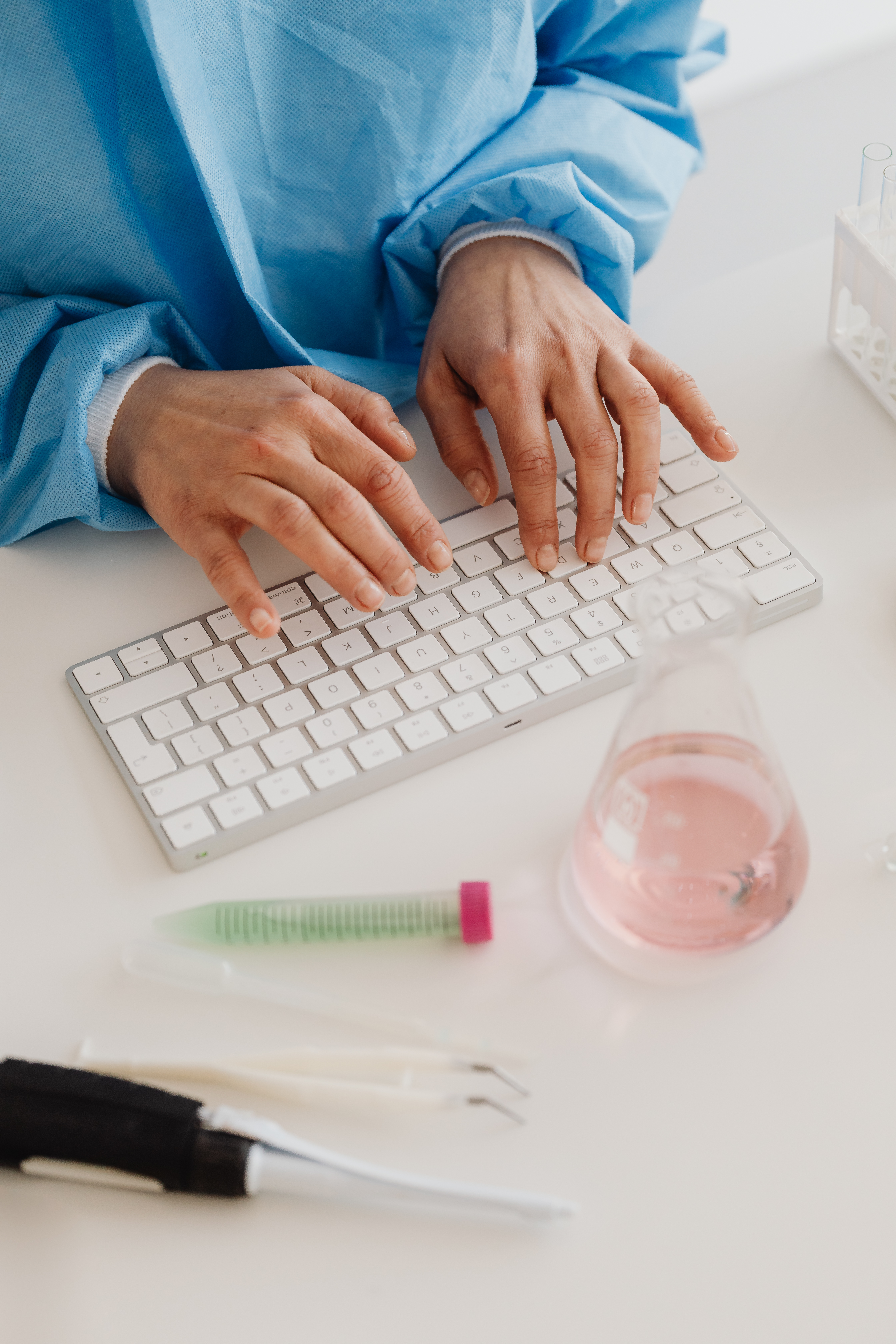 Female scientist - computer keyboard - work - desk