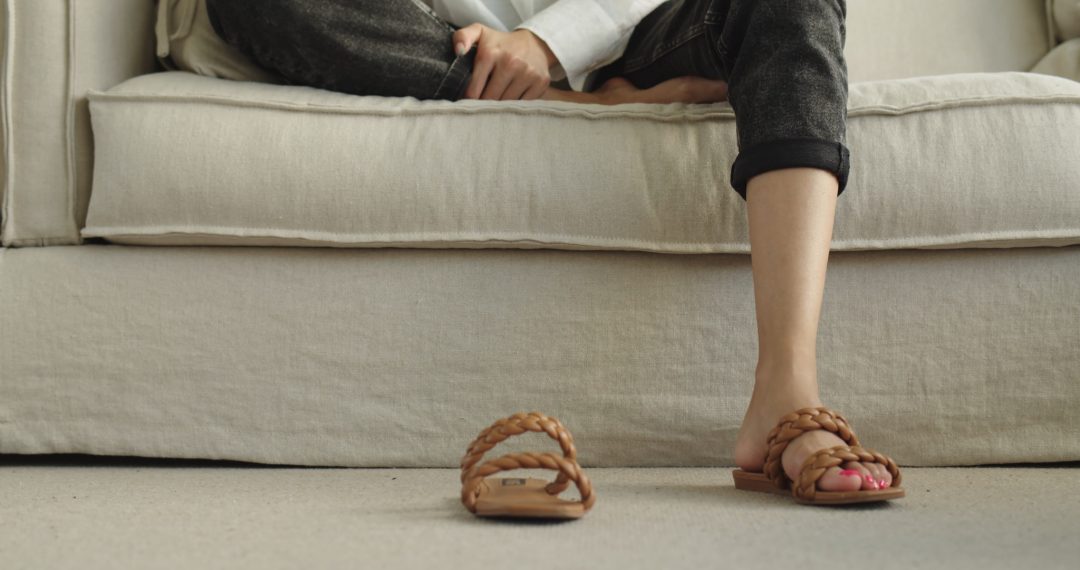 Woman's Feet with Pink Pedicure in Sandals