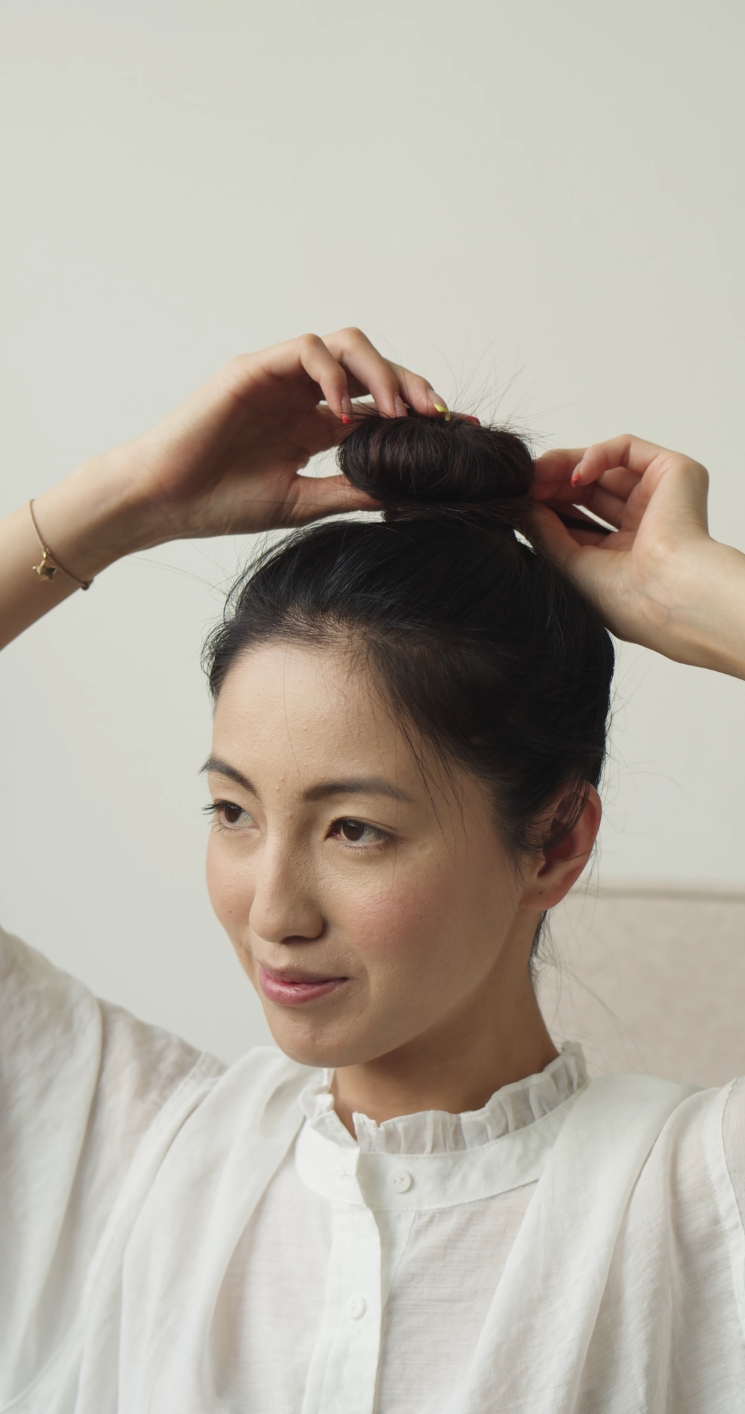 Woman Letting Hair Down from a Bun