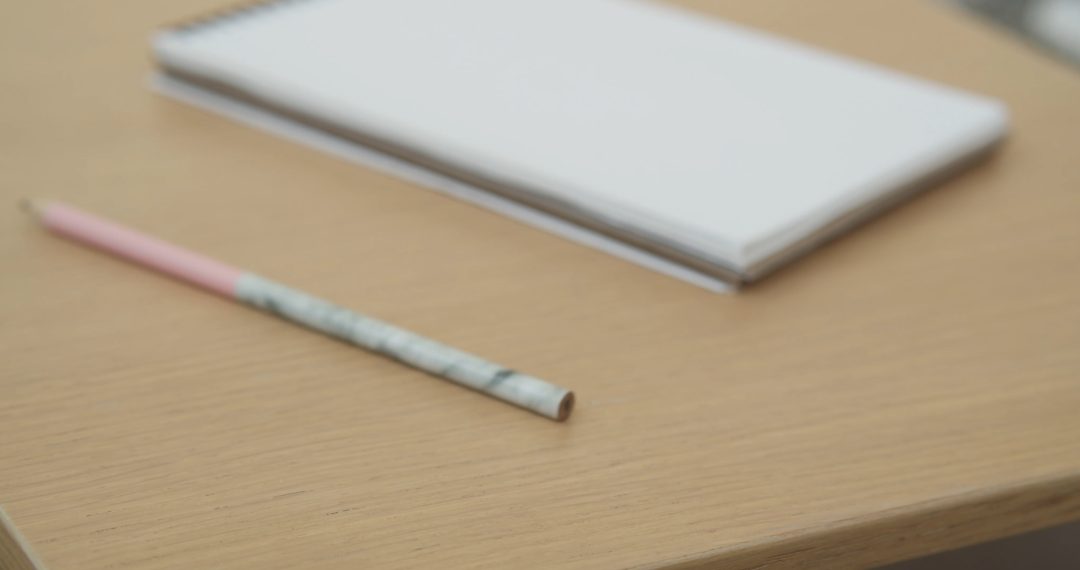 Putting a Notebook on a Desk, a Pencil Rolling down the Table 072