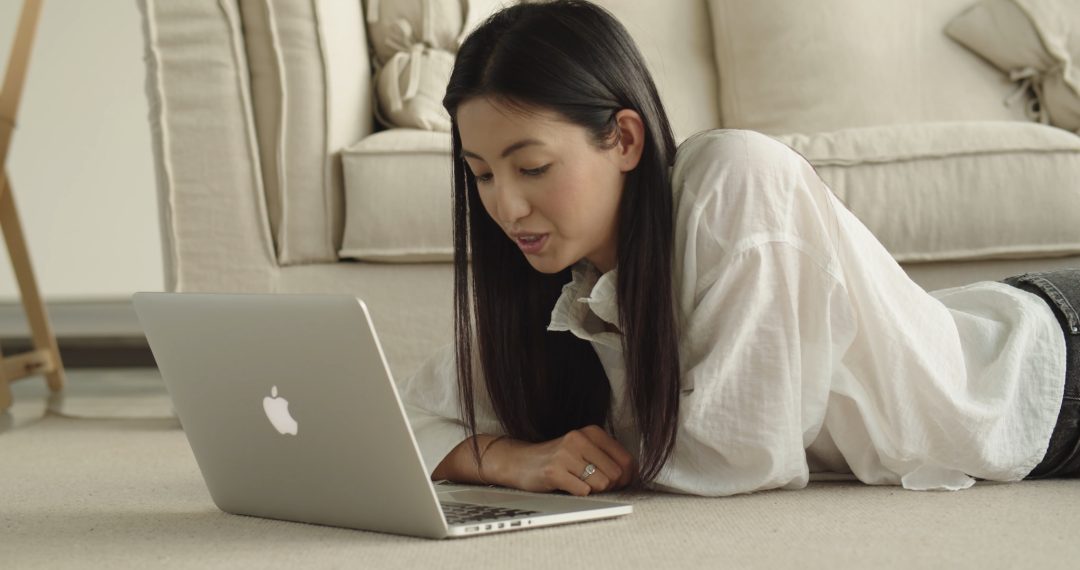 Woman Having an Online Meeting via Laptop