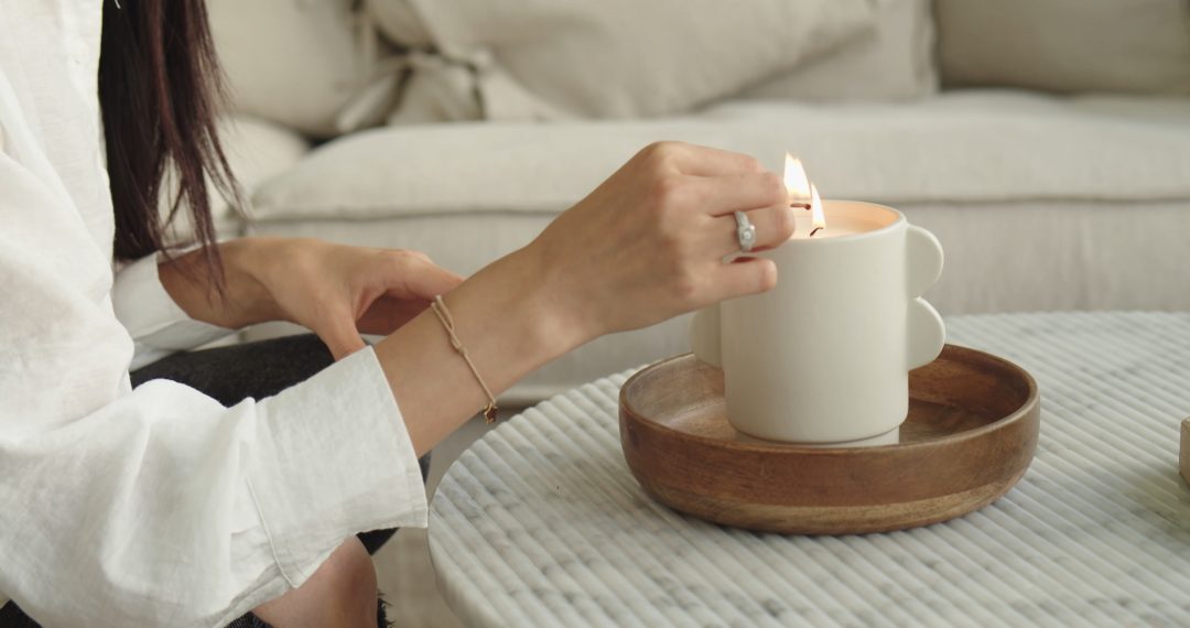 Woman Lighting a Candle