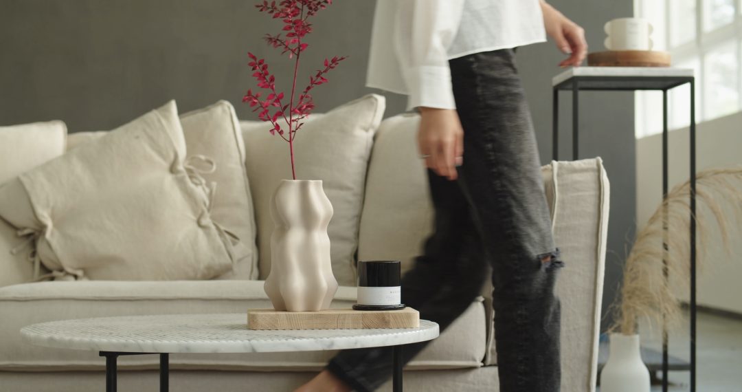 Woman Putting Flower into a Vase, Japandi Home Decor