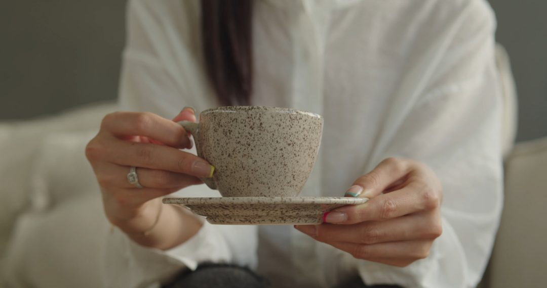 Woman Drinking a Cup of Tea Close-up