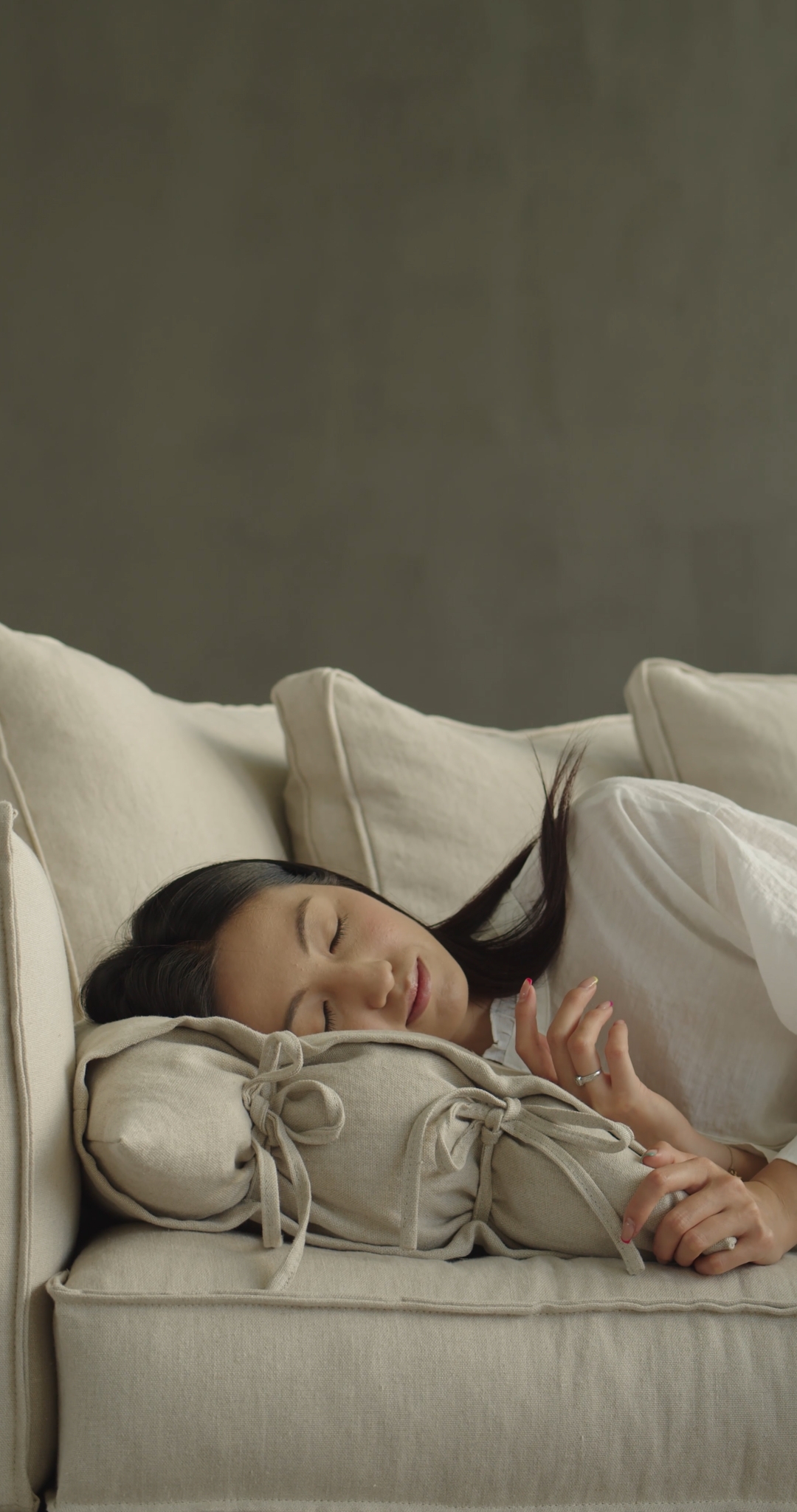 Woman Preparing for a Nap on The Couch