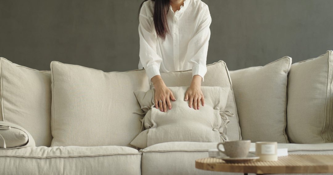 Woman Arranging a Living Room